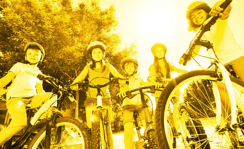 Group of children on bicycles in a park - Apple County Cycles, 11B Westpark, Wellington, Somerset