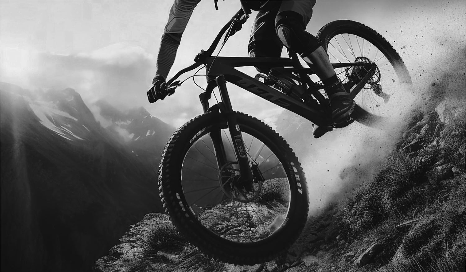 Black and white image of mountain biker coming down a hill - Apple County Cycles, 11B Westpark, Wellington, Somerset