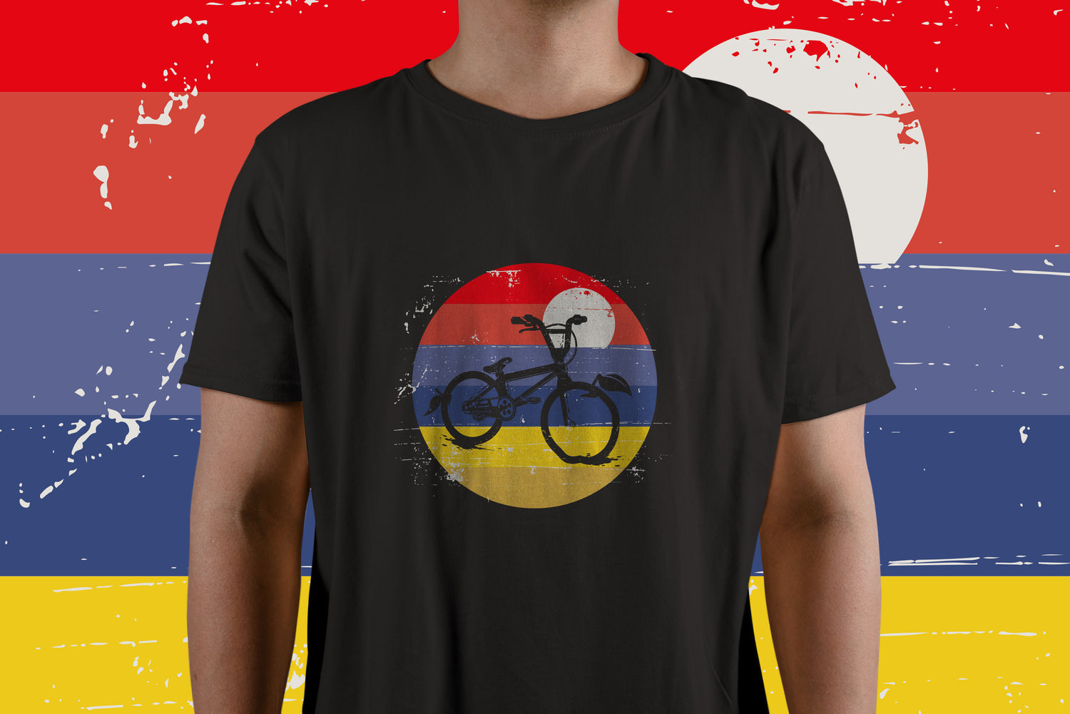Person wearing black T-shirt with a round logo in red blue and yellow - Apple County Cycles, 11B Westpark, Wellington, Somerset